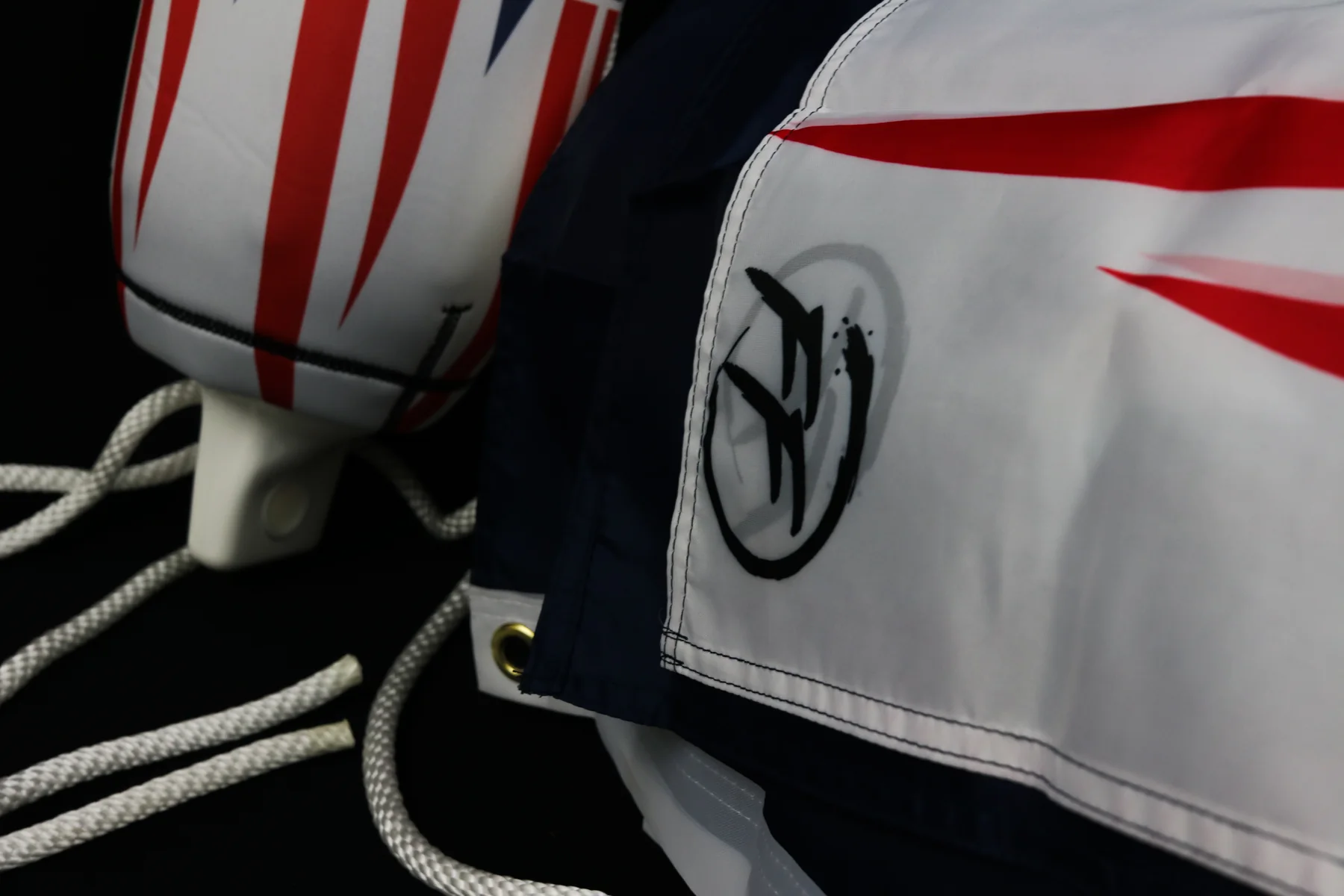American flag FenderSox detail beside Flexifabrics branded apparel