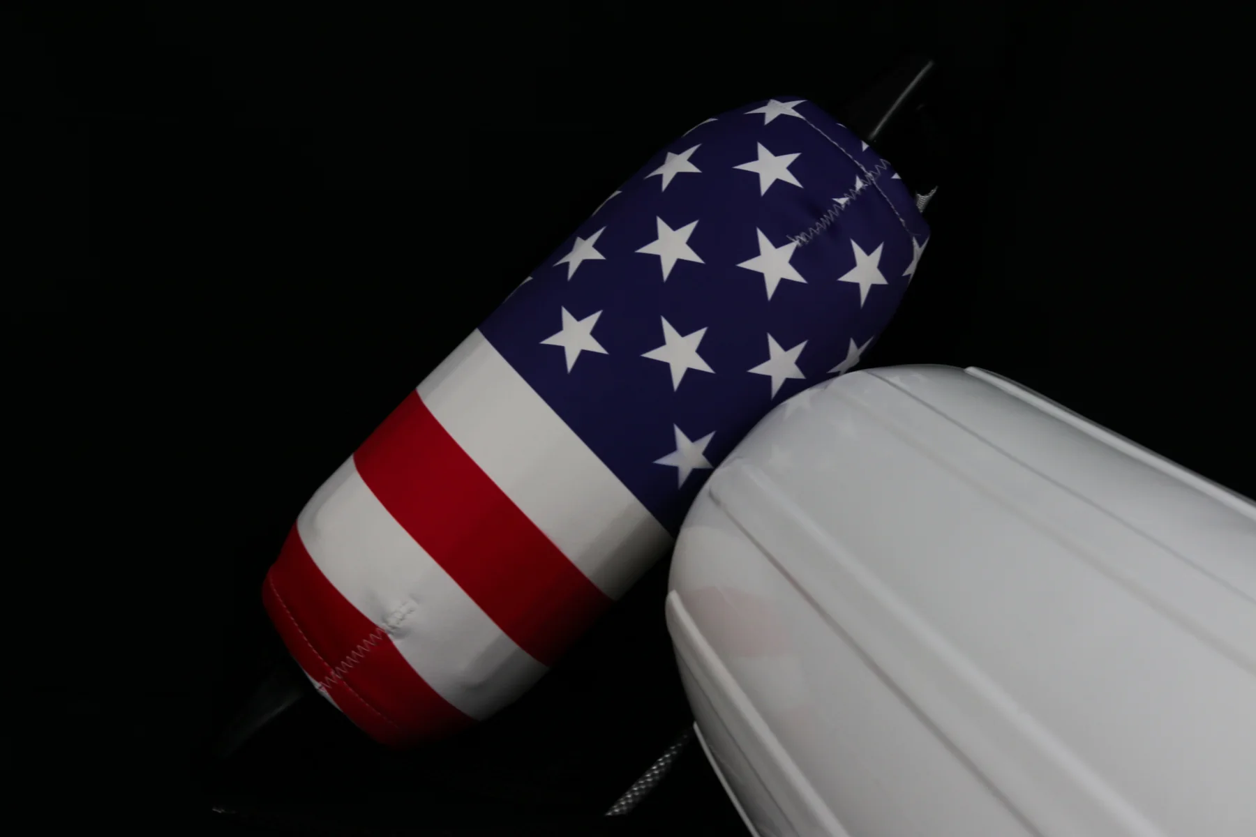 Classic American flag custom FenderSox beside a white boat fender