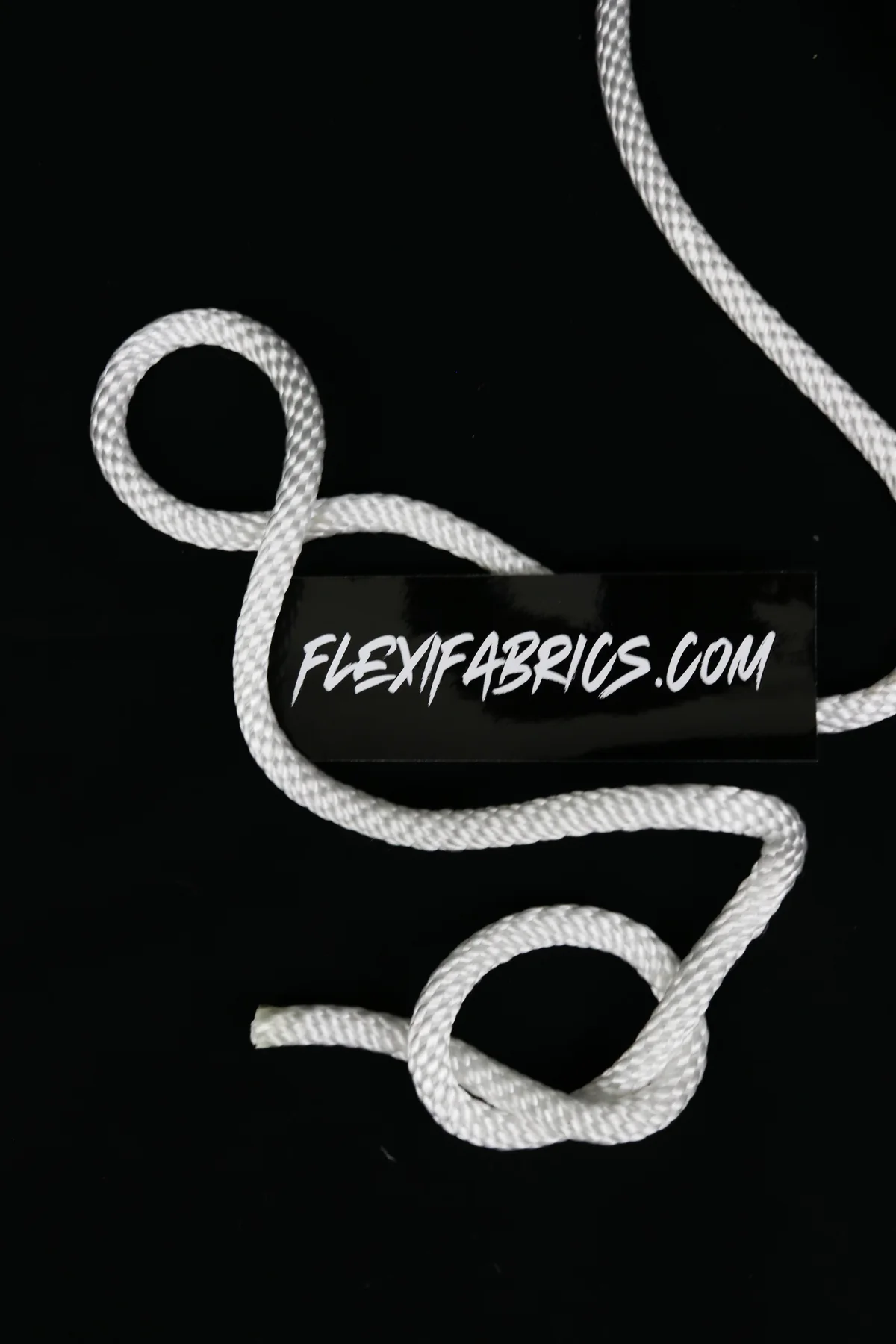 Flexifabrics.com brand tag arranged with white marine rope