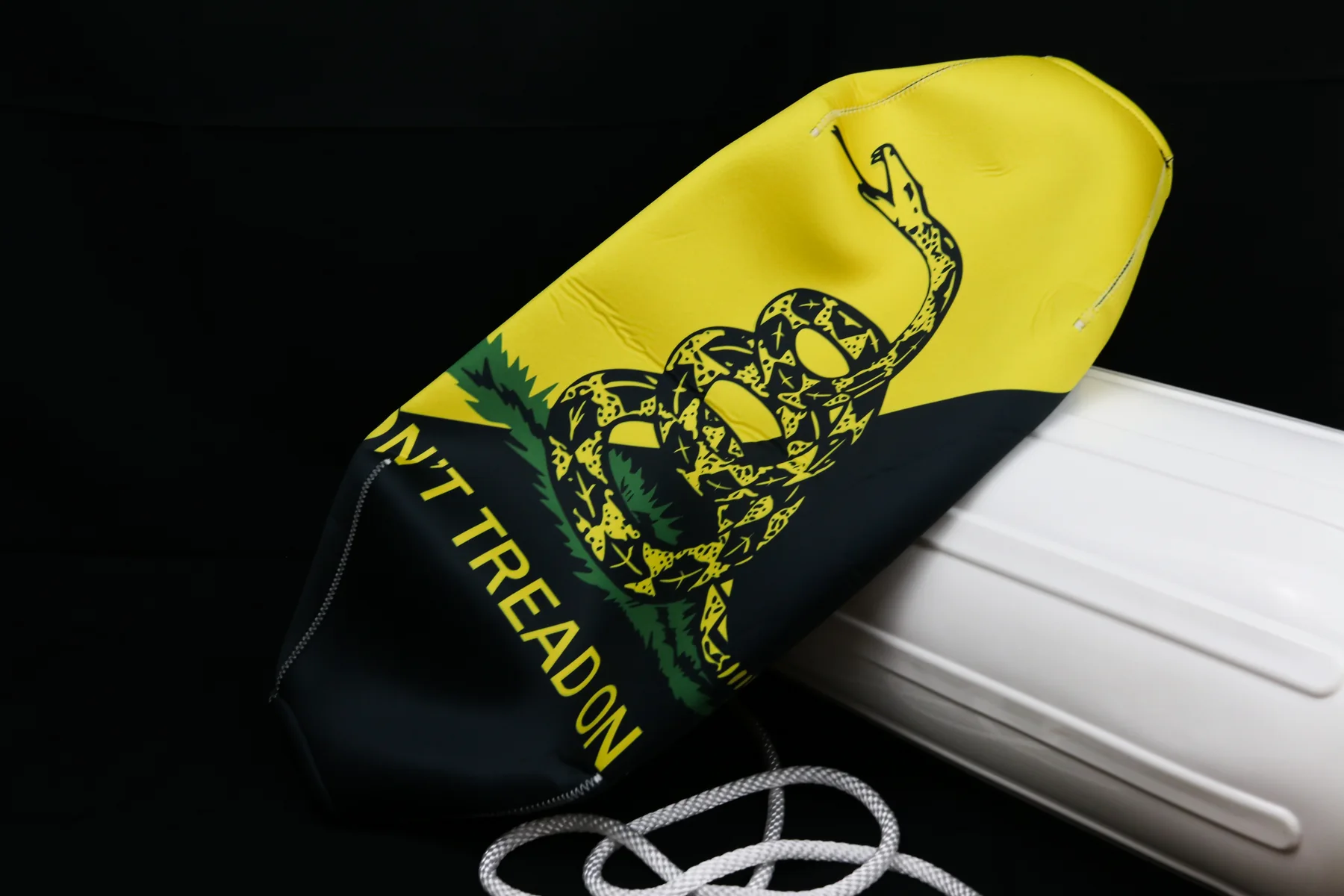 Yellow and black Don't Tread on Me custom FenderSox beside a white fender