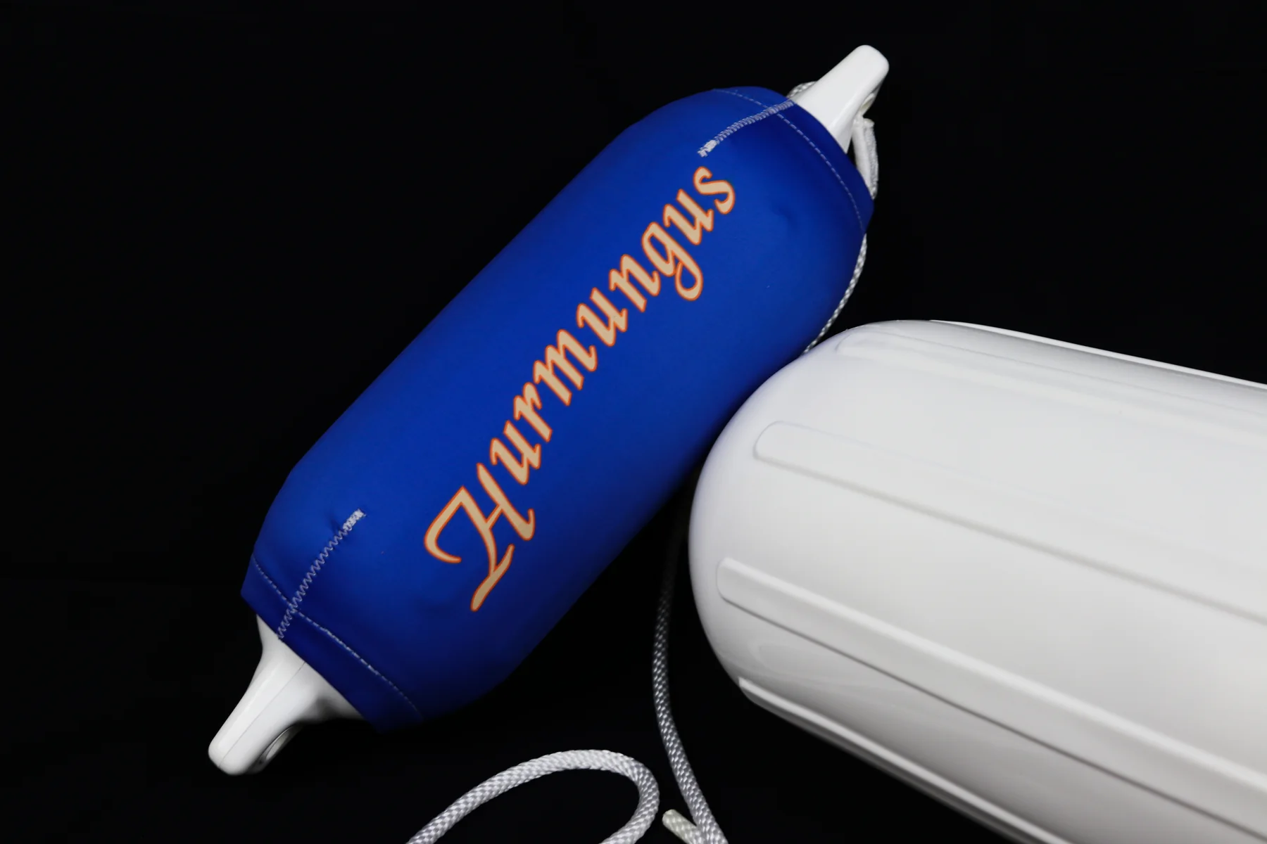 Blue Huntington script custom FenderSox beside a white fender