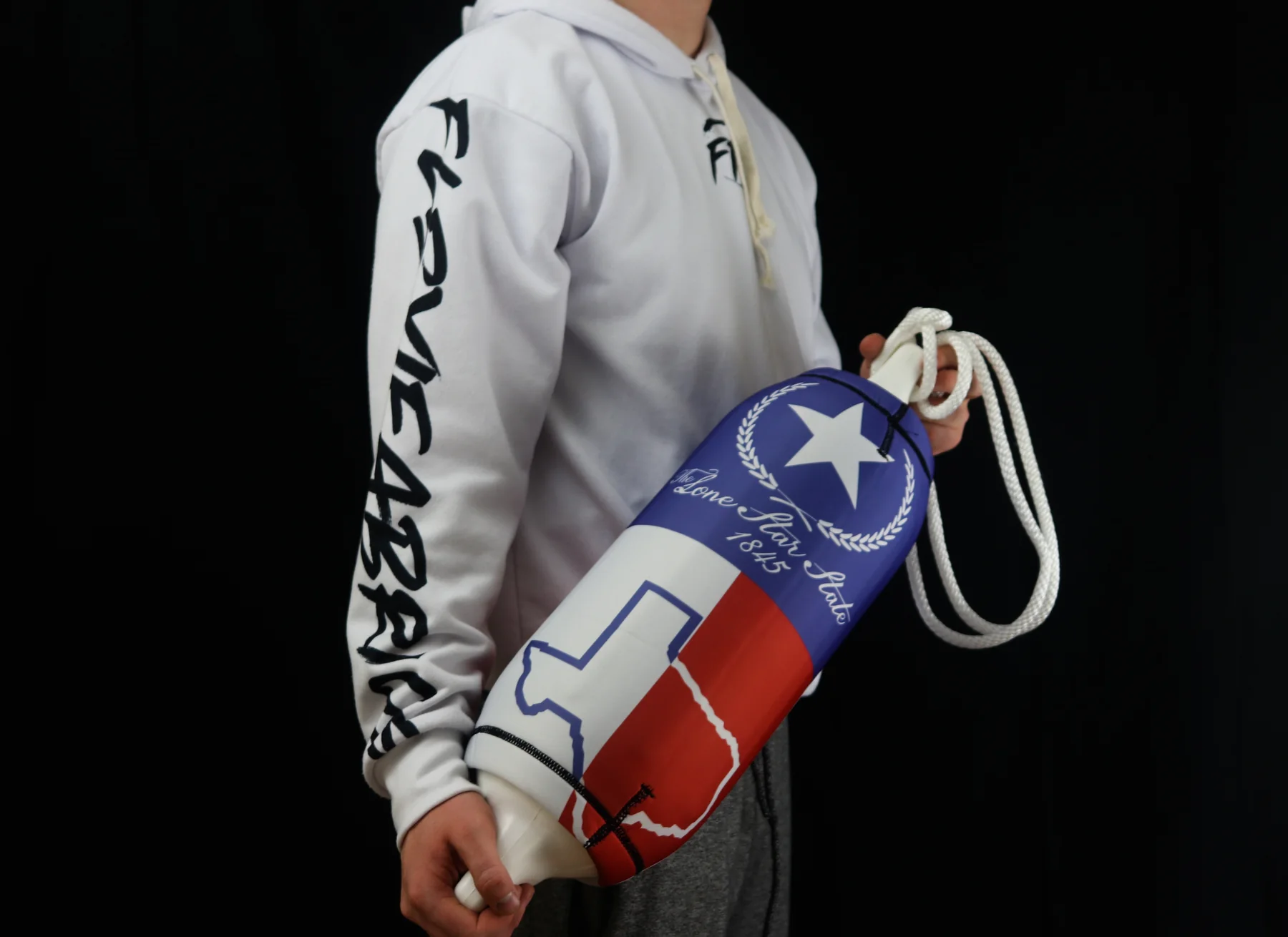 Texas Lone Star custom FenderSox carried against a black studio background