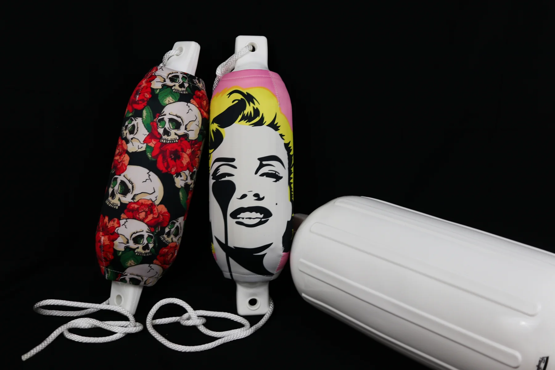 Pop-art portrait and skull-and-rose custom FenderSox pair