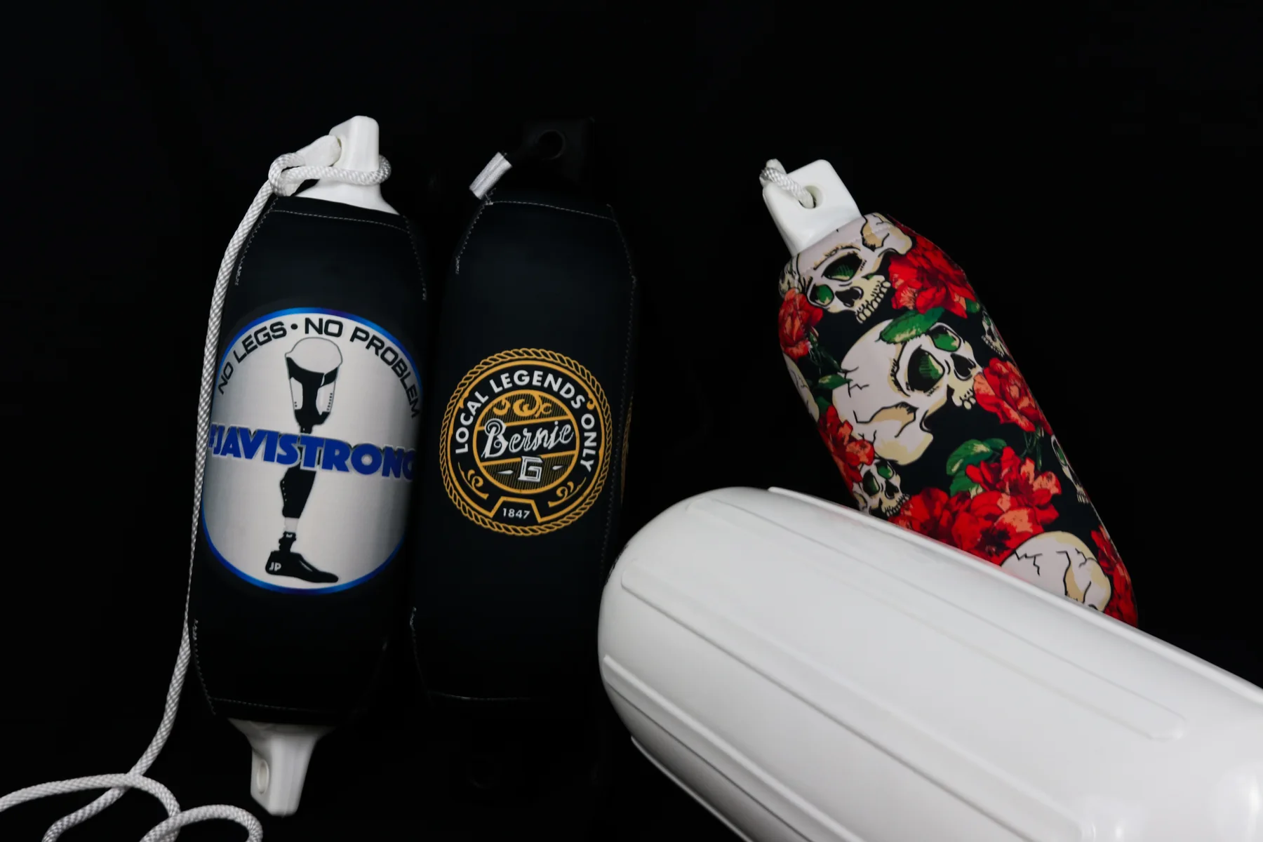 Air Force, Boston, and skull-and-rose custom FenderSox displayed as a mixed collection