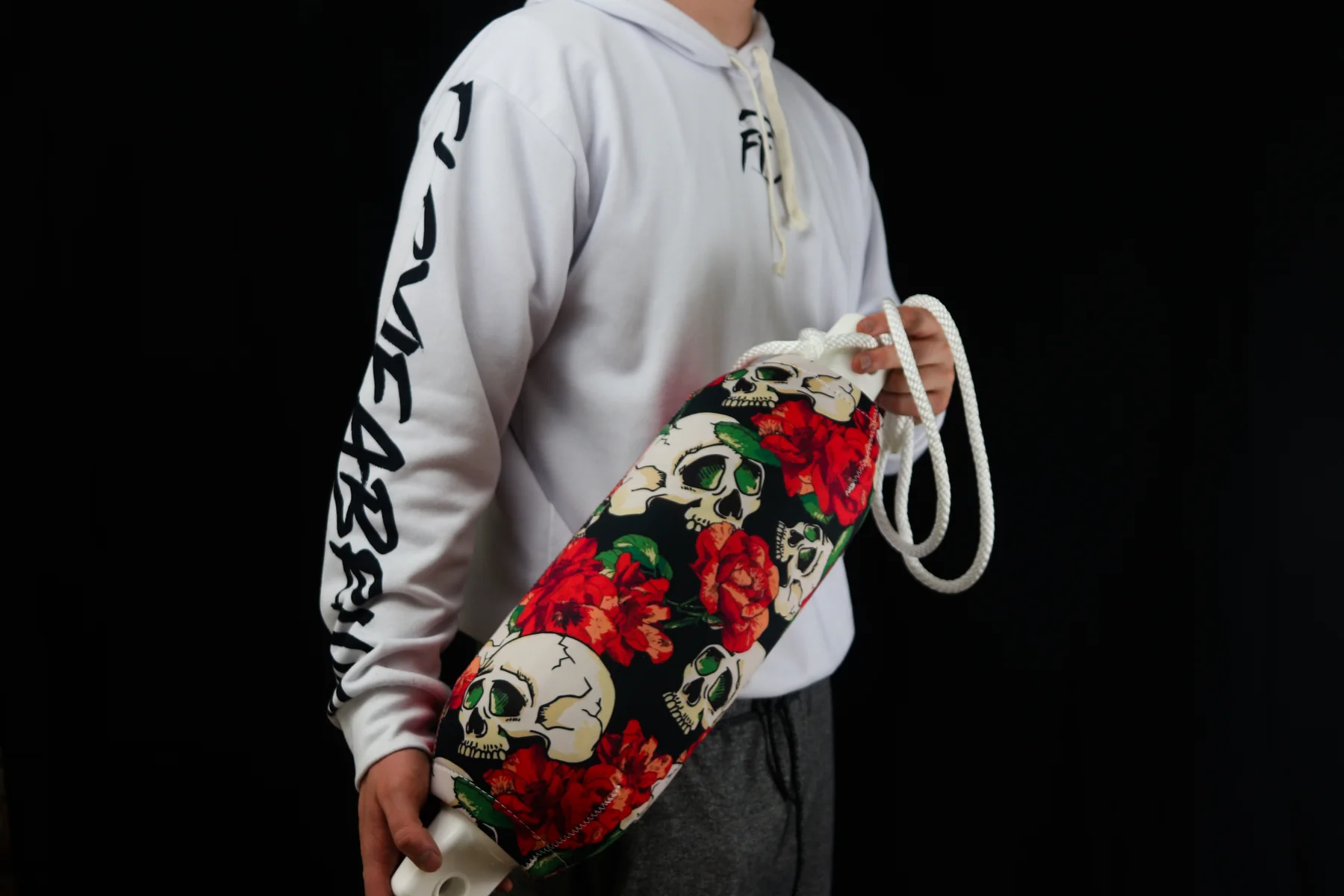 Skulls and red roses custom FenderSox cover shown against a black studio background