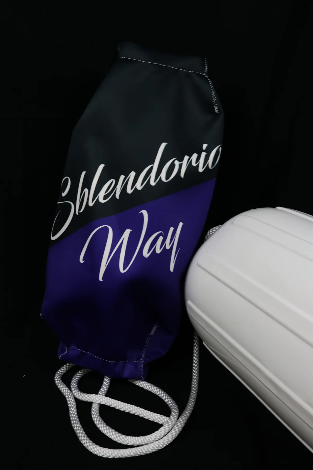 Navy Splendorio Way personalized FenderSox beside a white boat fender